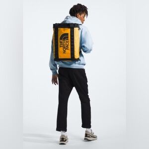 The North Face Yellow and Black Roll-Top Backpack